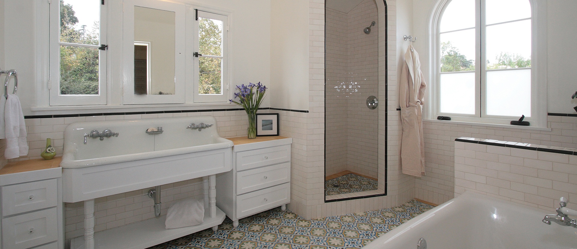 005-los-feliz-bathroom-double-pedestal-sink-cement-tile-custom-cabinets-arched-shower-light-pink-subway-tile